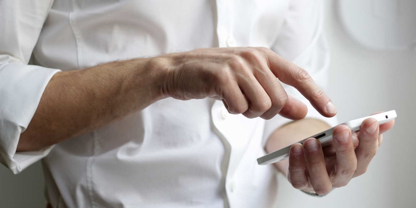A Man Using A Phone