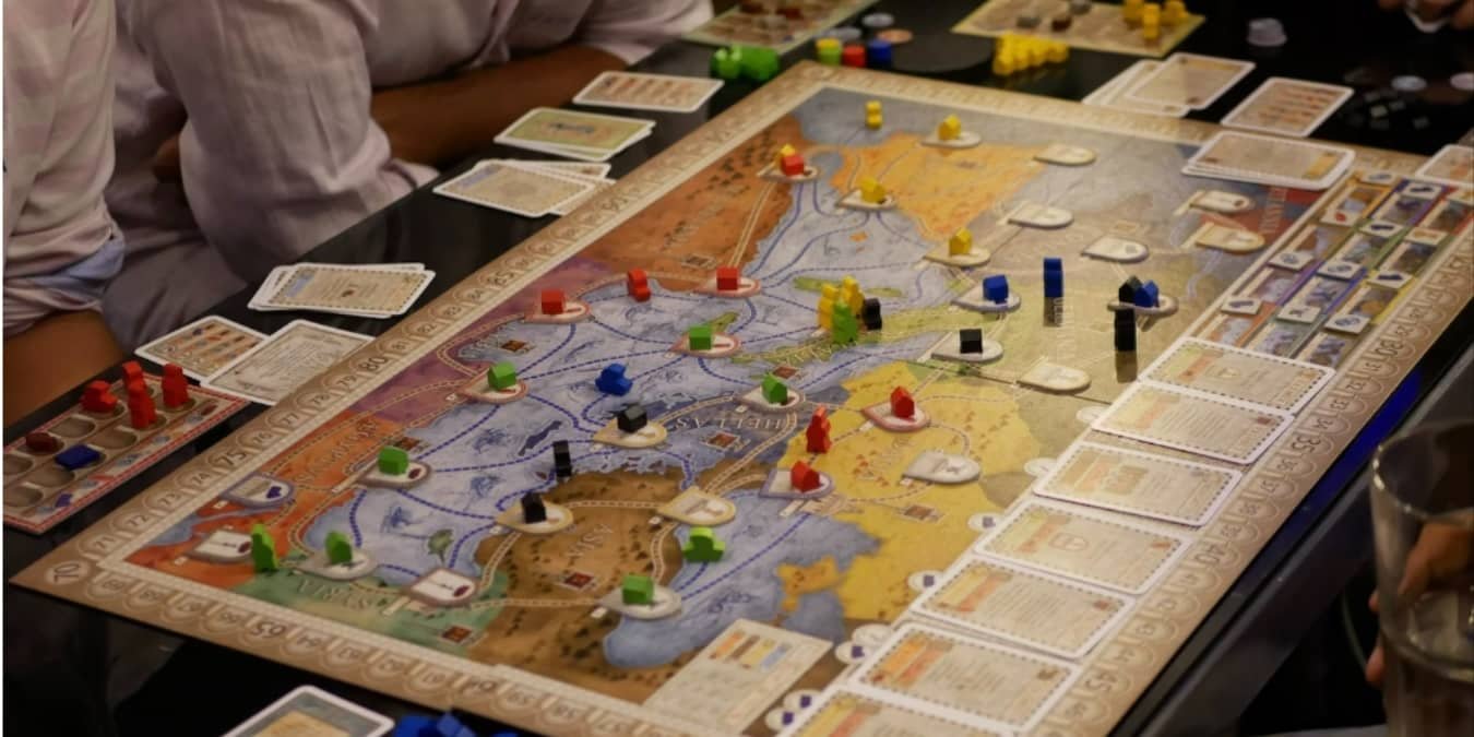 Group of people playing a board game.