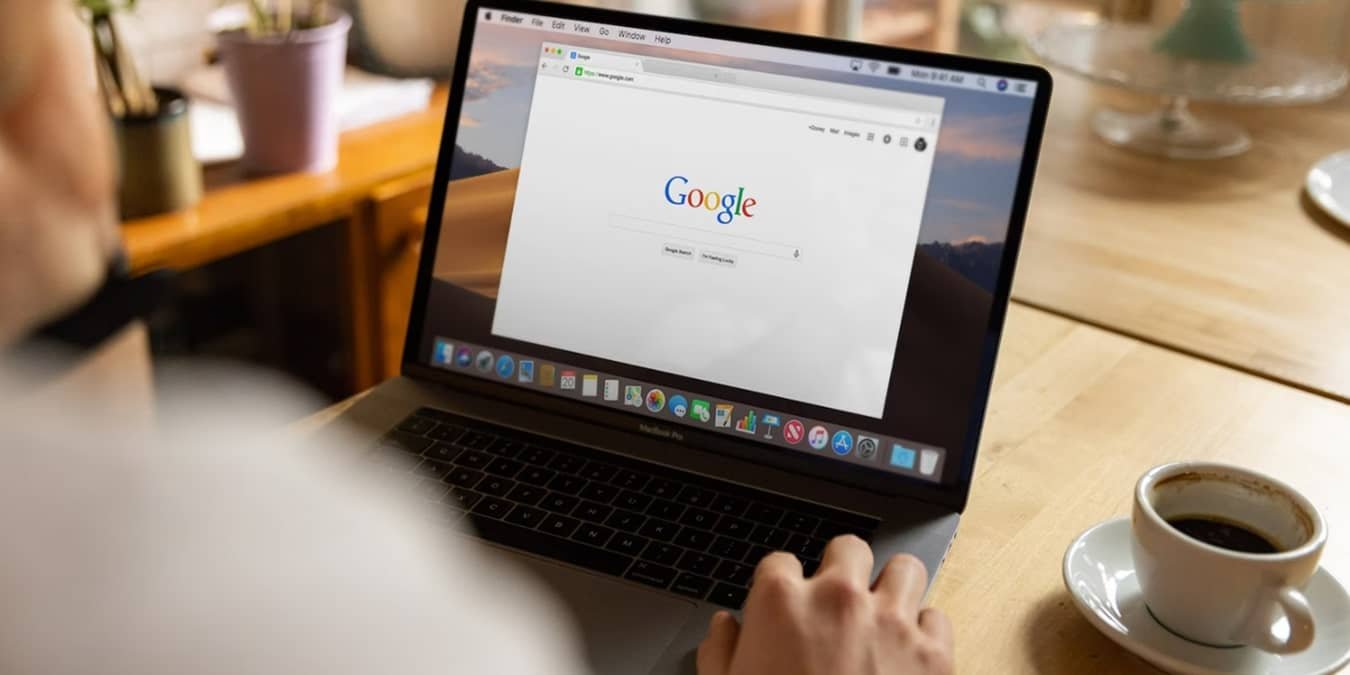 Man using Google on a laptop.