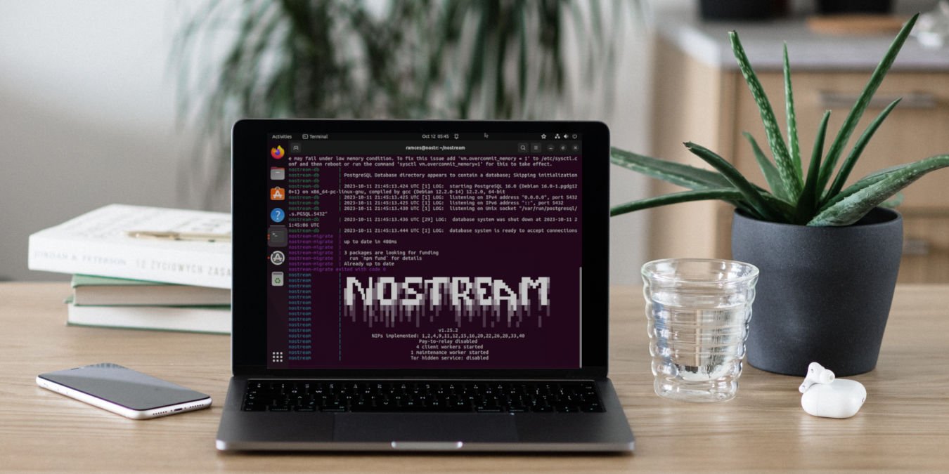 A photograph of a laptop on a wooden table.