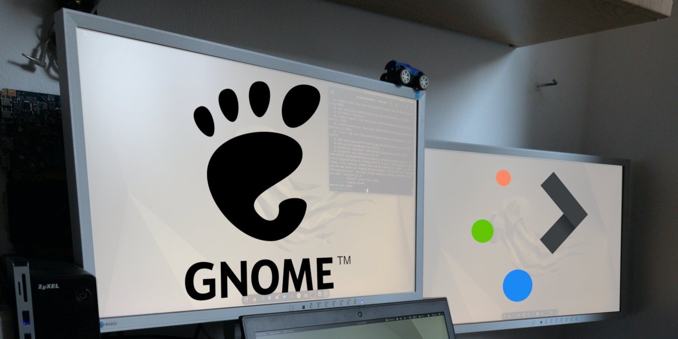 A photograph of a desktop with two monitors.