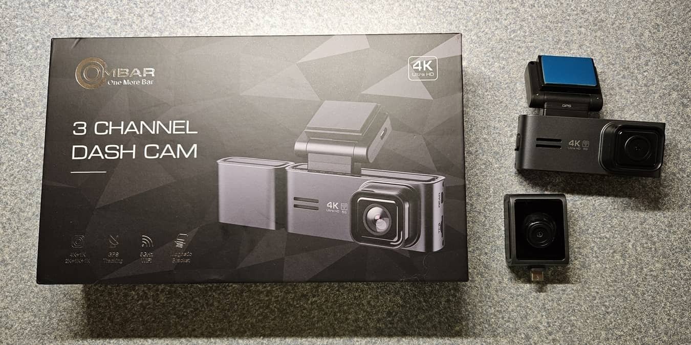 OMBAR Dash Cam with box, front camera, and inside camera.