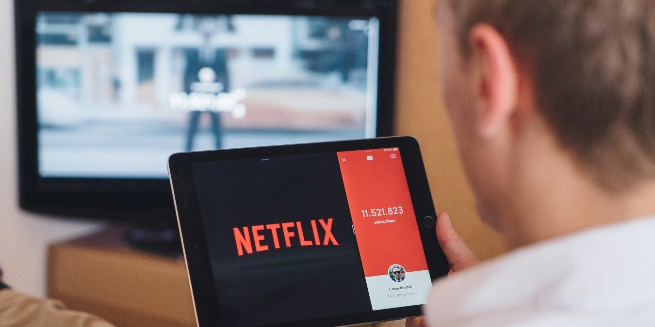 Person watching Netflix on a tablet
