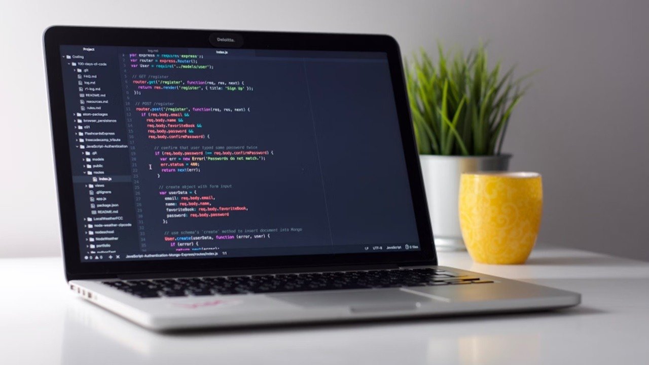 Laptop using VS Code themes.