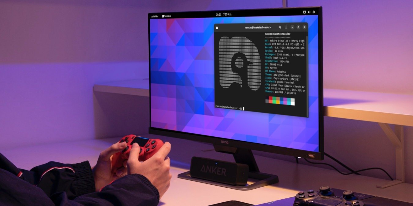 A photograph showing a desktop PC with a person holding a controller in front of it.