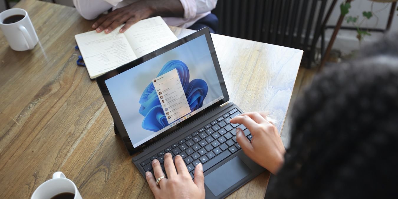Woman Using A Windows Laptop On A Table